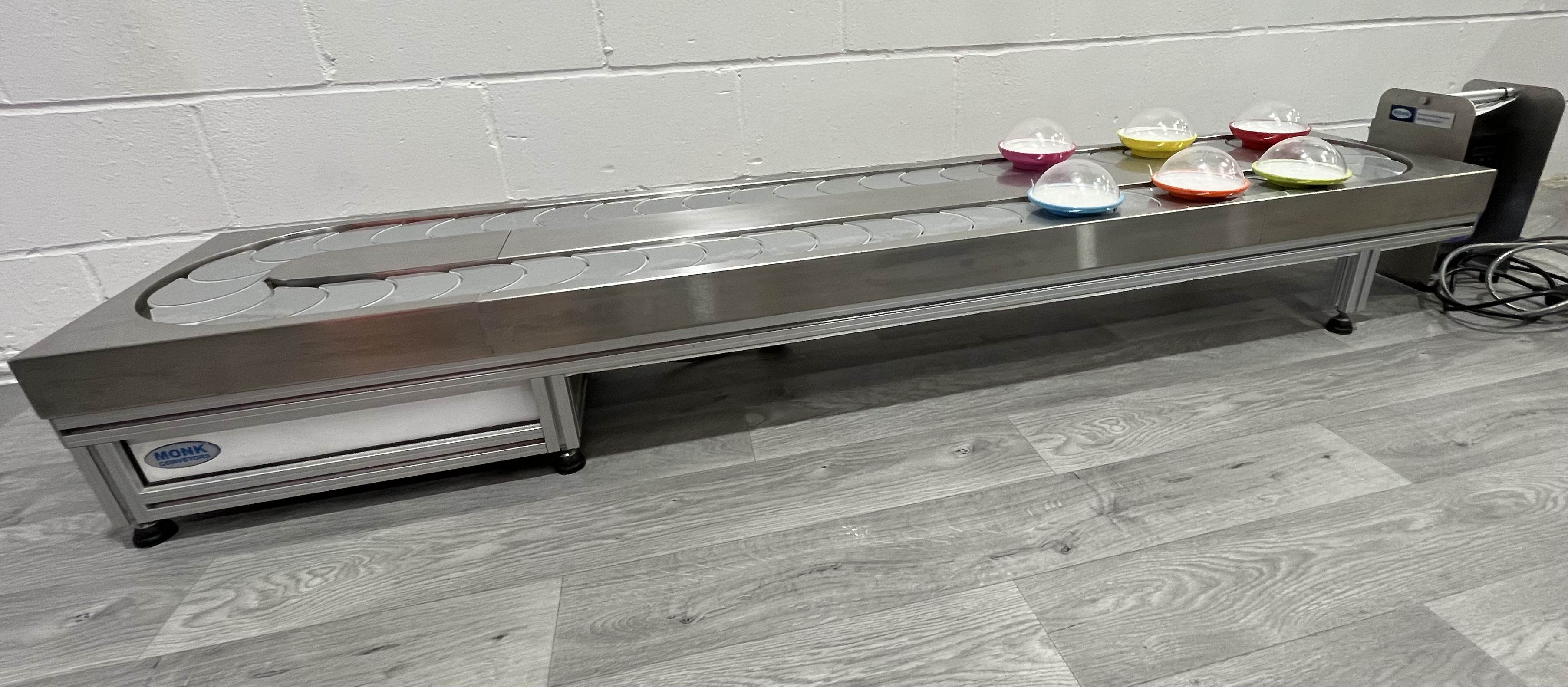 Sushi conveyor belt in action